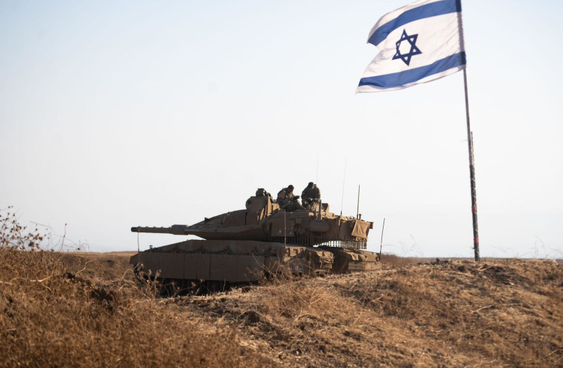  Israel's new ''Barak'' tank pictured by an Israeli flag. (credit: DEFENSE MINISTRY, IDF)