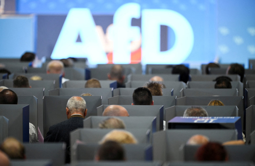  AfD members sit in voting booths on the day of the European election assembly 2023 of the Alternative for Germany (AfD) in Magdeburg, Germany, July 29, 2023.  (credit: REUTERS/ANNEGRET HILSE)