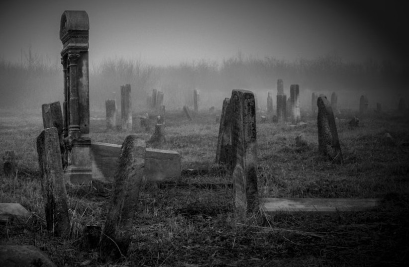  A black and white photo of an old cemetery. (credit: RAWPIXEL)