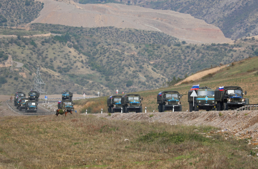  Vehicles of Russian peacekeepers leaving Azerbaijan's Nagorno-Karabakh region for Armenia pass an Armenian checkpoint on a road near the village of Kornidzor, Armenia September 22, 2023. (credit: REUTERS/Irakli Gedenidze/File Photo)