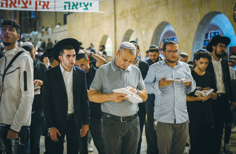  PRAYERS FOR forgiveness are recited before Yom Kippur, at the Western Wall.  (credit: Arie Leib Abrams/Flash90)
