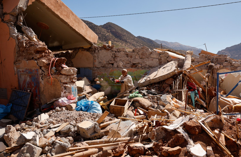  Ait Abdellah Brahim, 86, gestures among rubble, in the aftermath of a deadly earthquake, in Talat N'Yaaqoub, Morocco, September 16, 2023. (credit: REUTERS/AMMAR AWAD)