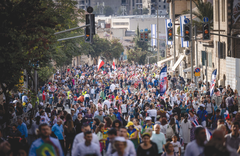  THOUSANDS OF Christian pilgrims and Israelis take part in the Feast of Tabernacles march in Jerusalem, last year. Many Israelis have come to trust Evangelical support, according to the writer. (credit: YONATAN SINDEL/FLASH90)