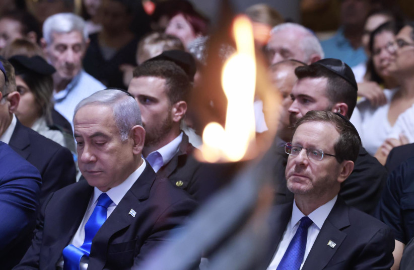  Prime Minister Benjamin Netanyahu and President Isaac Herzog are seen at the memorial service for the 50th anniversary of the Yom Kippur War.  (credit: MARC ISRAEL SELLEM)