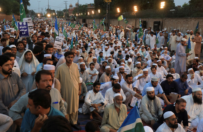  Supporters of the religious and political party Jamaat-e-Islami (JI) listen to the speech of their leader as they gather against the hike on fuel prices and power bills inflation, during a protest in Peshawar, Pakistan. September 18, 2023. (credit: Fayaz Aziz/Reuters)