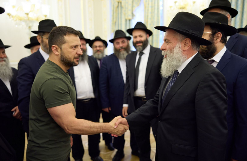 President of Ukraine Volodymyr Zelensky shakes hand of Chief Rabbi of Kyiv Rabbi Yonatan Markovitch at gathering 2 weeks prior to the Jewish New Year (credit: courtesy of Presidential Office)