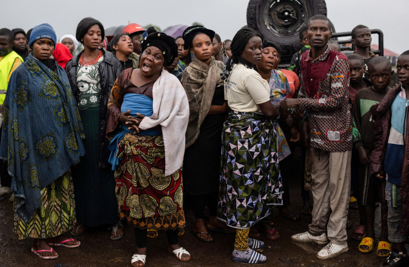  Relatives react as the coffin of a protestor killed during a demonstration is carried before burial at the Makao cemetery in Goma, North Kivu province, Democratic Republic of the Congo September 18, 2023. (credit: REUTERS/Arlette Bashizi)