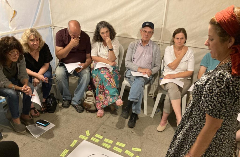  Israelis gather in a sukkah for respectful dialogue, as part of a project taking place across the country this week. (credit: Courtesy)