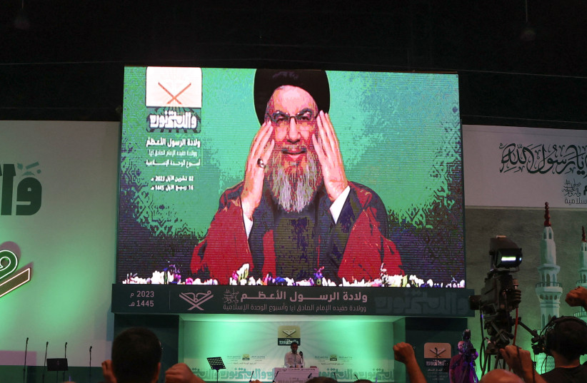 Lebanon's Hezbollah leader Sayyed Hassan Nasrallah addresses his supporters via a screen during a rally marking Prophet Mohammed's birthday, in Beirut suburbs, Lebanon. October 2, 2023.