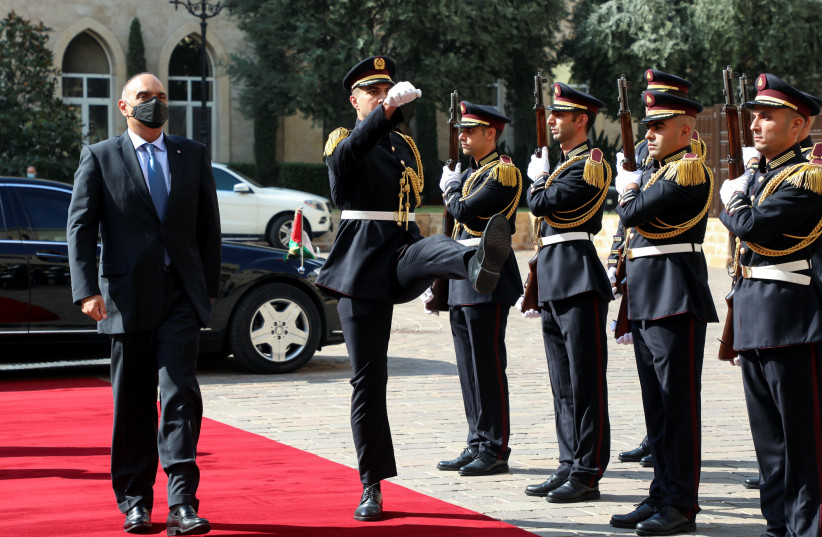  Jordanian Prime Minister Bisher al-Khasawneh reviews an honor guard upon his arrival to meet with Lebanese Prime Minister Najib Mikati at the government palace in Beirut, Lebanon September 30, 2021. (credit: REUTERS/MOHAMED AZAKIR)