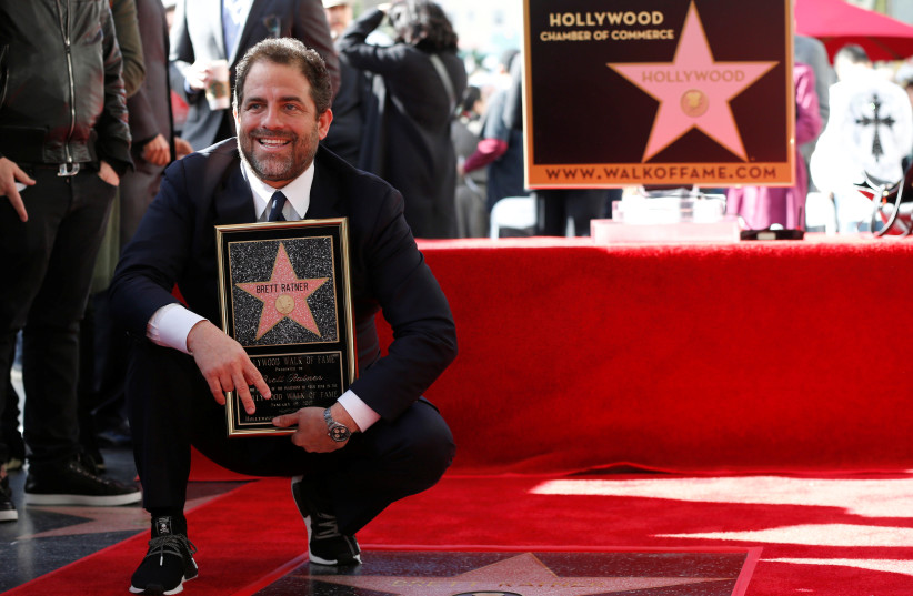  Director Brett Ratner poses on his star after it was unveiled on the Hollywood Walk of Fame in Hollywood, California U.S., January 19, 2017. (credit: REUTERS/MARIO ANZUONI)