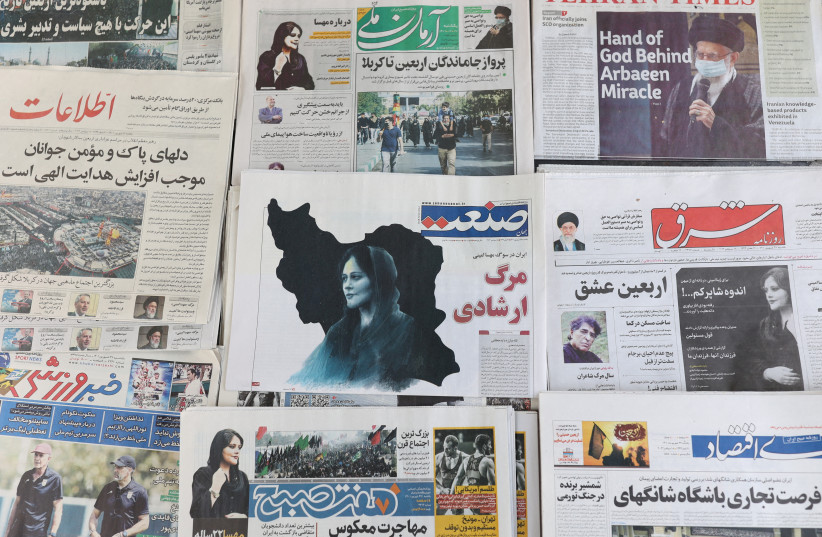   Newspapers, with a cover picture of Mahsa Amini, a woman who died after being arrested by the Islamic republic's ''morality police'' are seen in Tehran, Iran September 18, 2022. (credit: MAJID ASGARIPOUR/WANA (WEST ASIA NEWS AGENCY) VIA REUTERS)