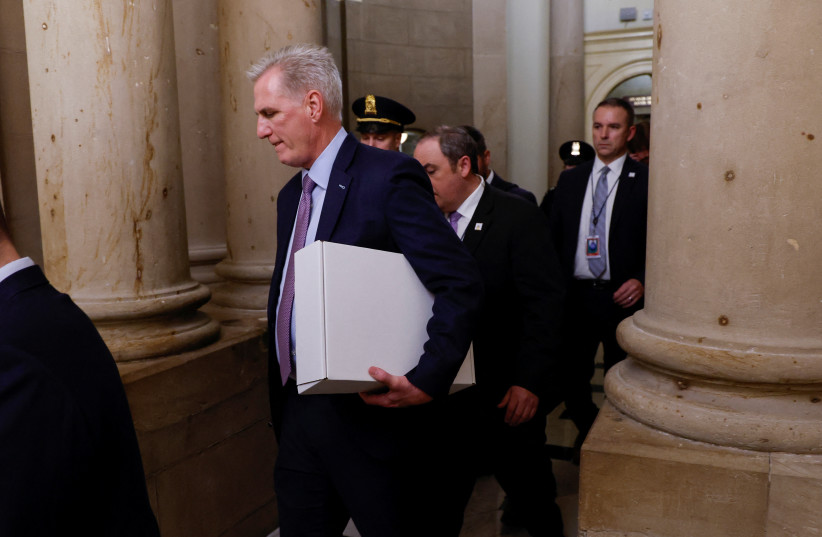 OUSTED US House speaker Kevin McCarthy walks back to his office after a motion to end his leadership passed on Tuesday.  (credit: JONATHAN ERNST/REUTERS)