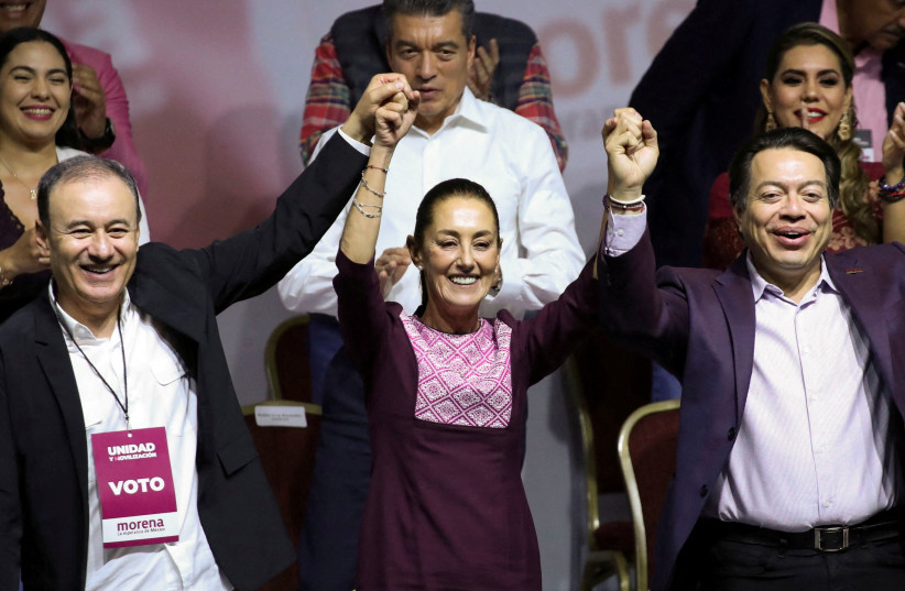  Former Mexico City Mayor Claudia Sheinbaum gestures next to President of the ruling National Regeneration Movement (MORENA) party Mario Delgado and President of the National Council of the MORENA party Alfonso Durazo, on the day she is certified as presidential candidate for the ruling National Reg (credit: REUTERS/HENRY ROMERO)