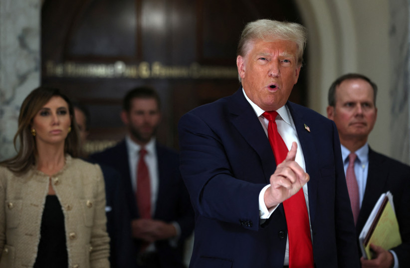  Former U.S. President Donald Trump gestures while talking to the media during a break as he attends trial in a civil fraud case brought by state Attorney General Letitia James against him, his adult sons, the Trump Organization and others in New York City, U.S., October 4, 2023. (credit: REUTERS/MIKE SEGAR)