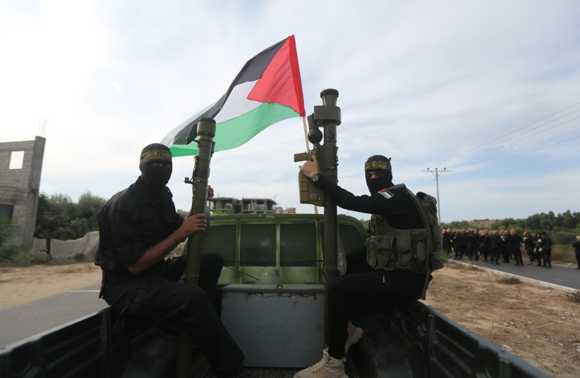  Members of the Al-Quds Brigades, the military wing of the Islamic Jihad movement in Palestine, organize a large military parade and display of new missiles, on the 36th anniversary of the launch, in Gaza City, on October 4, 2023 (credit: ATIA MOHAMMED/FLASH90)