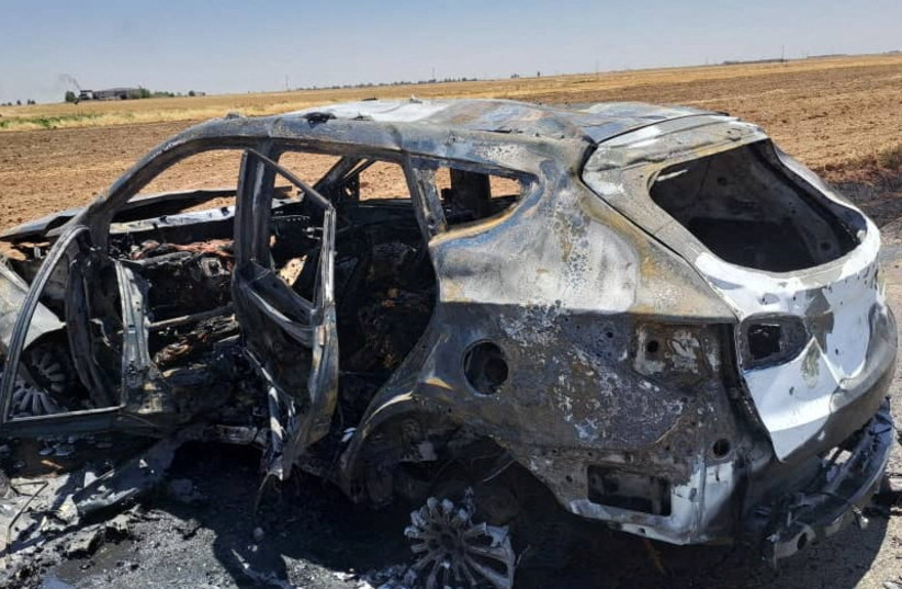  A burnt vehicle is pictured after, what medical and security sources say, was targeted by a Turkish drone strike in the village of Tal Shaeer, Syria June 20, 2023.  (credit: HAWARNEWS/Handout via REUTERS)