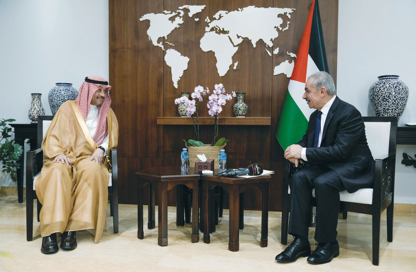  NAYEF AL-SUDAIRI, Saudi Arabia’s first-ever ambassador to the Palestinian Authority, speaks with PA Prime Minister Mohammad Shtayyeh in Ramallah last month. (credit: Majdi Mohammed/Pool/REUTERS)