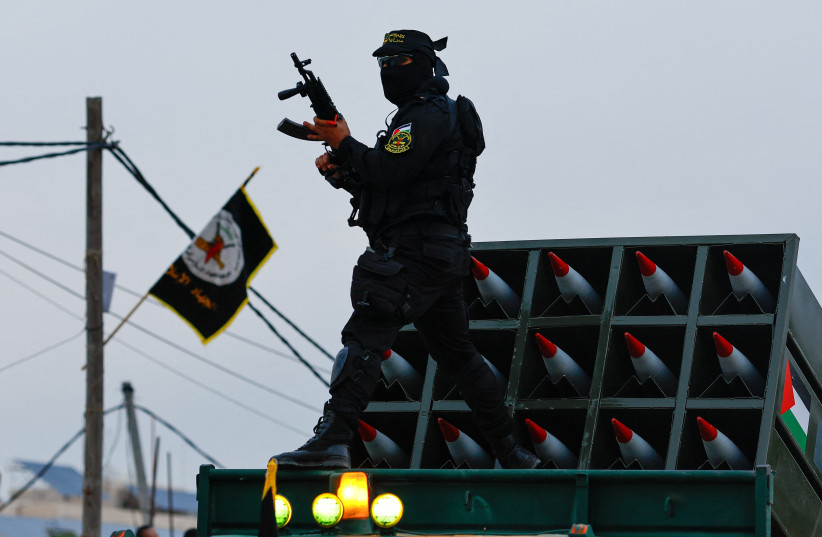  A Palestinian Islamic Jihad militant participates in an anti-Israel military parade marking the 36th anniversary of the movement's foundation in Gaza City, October 4, 2023 (credit: REUTERS/MOHAMMED SALEM)