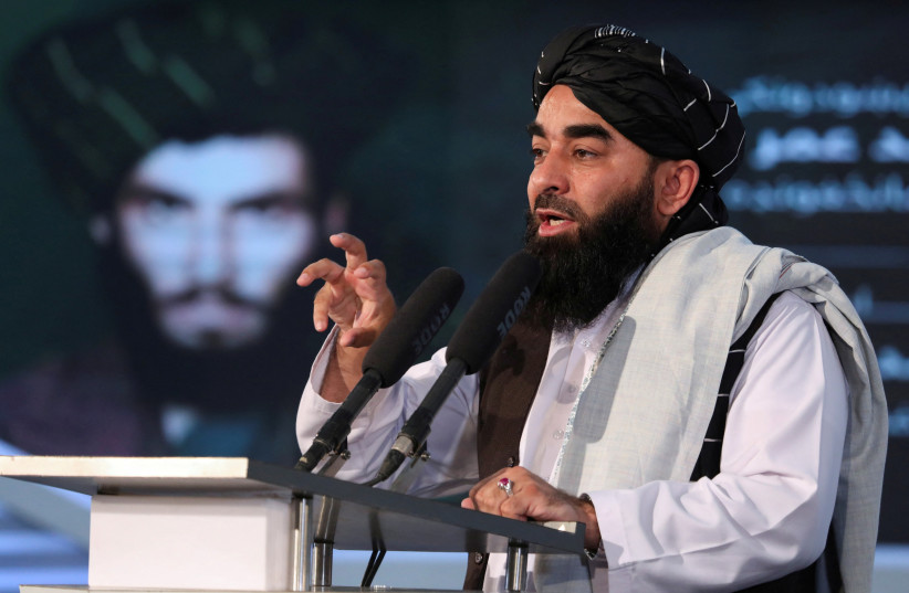  Afghan Taliban's Deputy Minister of Information and Culture and spokesman Zabihullah Mujahid speaks during the death anniversary of Mullah Mohammad Omar, the late leader and founder of the Taliban, in Kabul, Afghanistan, April 24, 2022. (credit: REUTERS/Ali Khara/File Photo)