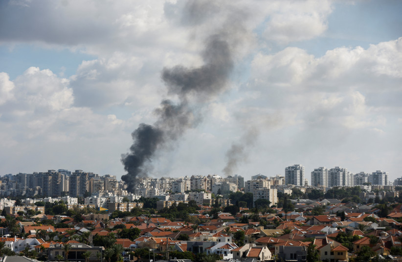  Smoke rises in the aftermath of rocket barrages that were launched from Gaza, in Ashkelon, Israel October 7, 2023.  (credit: REUTERS/AMIR COHEN)