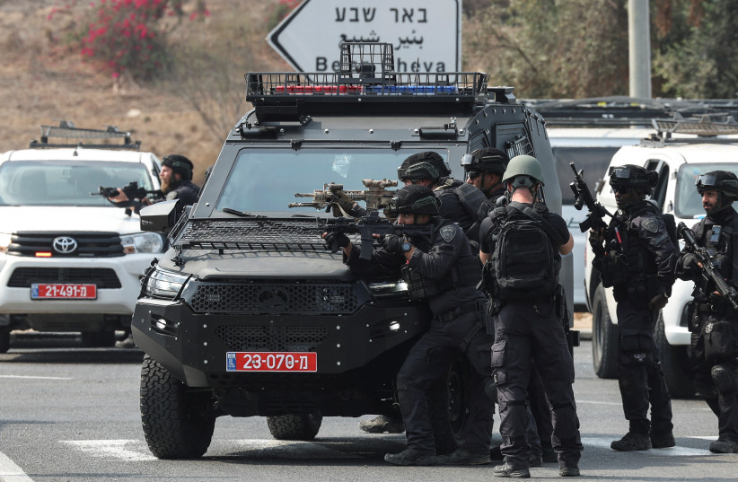  Israeli security stand in position on a road following a mass infiltration by Hamas gunmen from the Gaza Strip, near Sderot in southern Israel October 8, 2023. (credit: RONEN ZVULUN/REUTERS)
