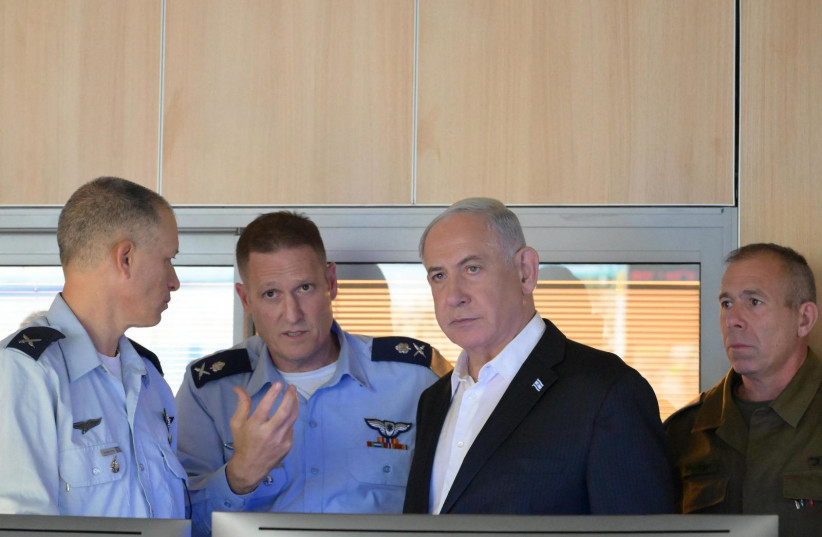  Israeli Prime Minister Benjamin Netanyahu with senior military officers in an Israeli Air Force war room, October 8, 2023. (credit: AMOS BEN-GERSHOM/GPO)