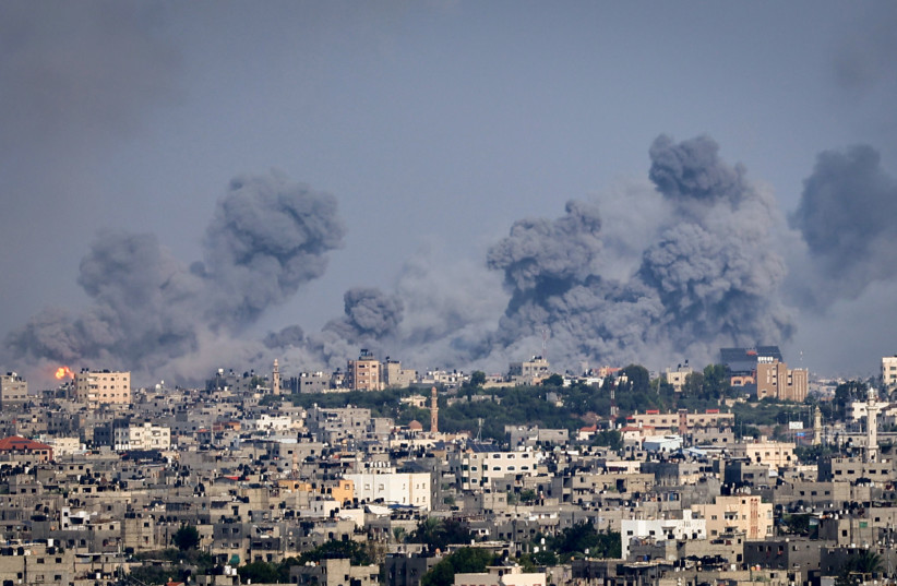 Smoke rises after Israeli air strikes near the border east of the city of Rafah in the southern Gaza Strip, October 8, 2023 (credit: ATIA MOHAMMED/FLASH90)