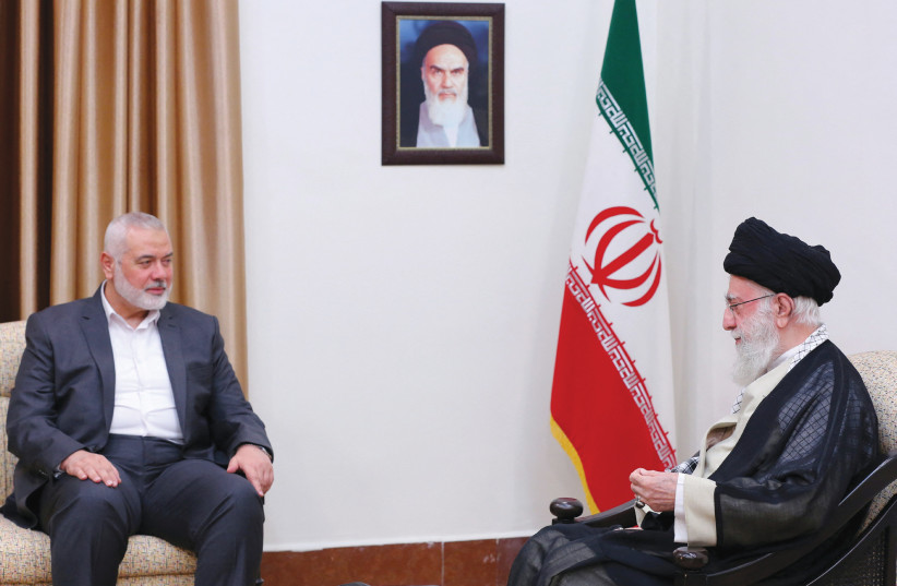  Iran's Supreme Leader Ayatollah Ali Khamenei meets with Hamas leader Ismail Haniyeh in Tehran, Iran, in June. (credit: Office of the Iranian Supreme Leader/West Asia News Agency/Reuters)