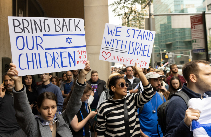  Pro-Israel demonstrators protest during the second day of the ongoing conflict between Israel and the Palestinian militant group Hamas, in Manhattan in New York City, U.S., October 8, 2023.  (credit: REUTERS/JEENAH MOON)