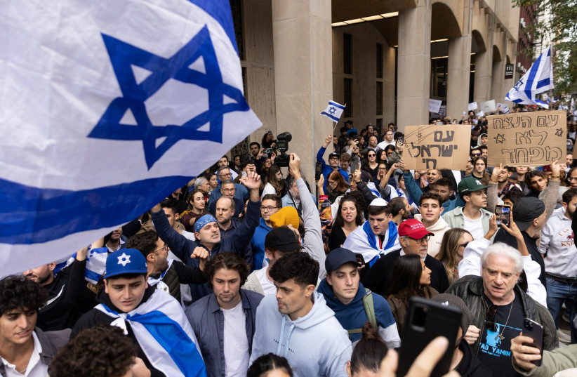  Pro-Israel demonstrators protest during the second day of the ongoing conflict between Israel and the Palestinian militant group Hamas, in Manhattan in New York City, U.S., October 8, 2023.  (credit: REUTERS/JEENAH MOON)