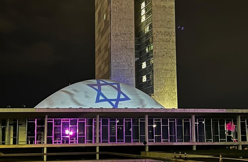  The flag of Israel was laser projected over the building of Brazil's National Congress in solidarity with the Israeli victims of Hamas (credit: MARCUS M. GILBAN)