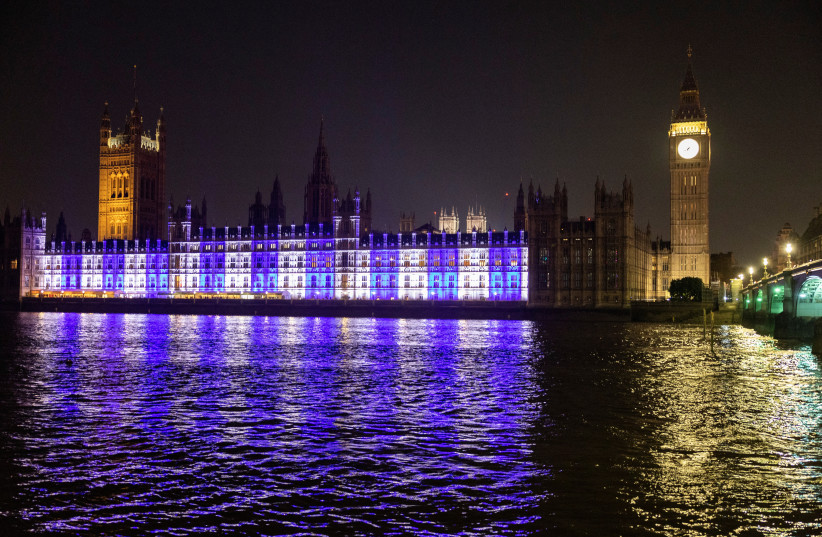  The House of Commons in Westminster is illuminated in the colours of the flag of Israeli, in London, Britain, October 9, 2023 (credit: REUTERS/CLODAGH KILCOYNE)