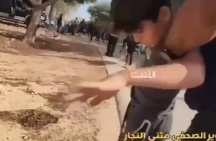 A video posted by Hamas shows Erez being taken by a terrorist