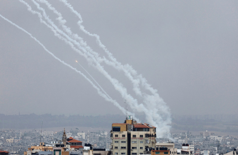  ROCKETS ARE fired from Gaza toward Israel, on Monday. This past weekend has demonstrated that Israel cannot allow a brutal terrorist state to continue to exist alongside it. (credit: MOHAMMED SALEM/REUTERS)
