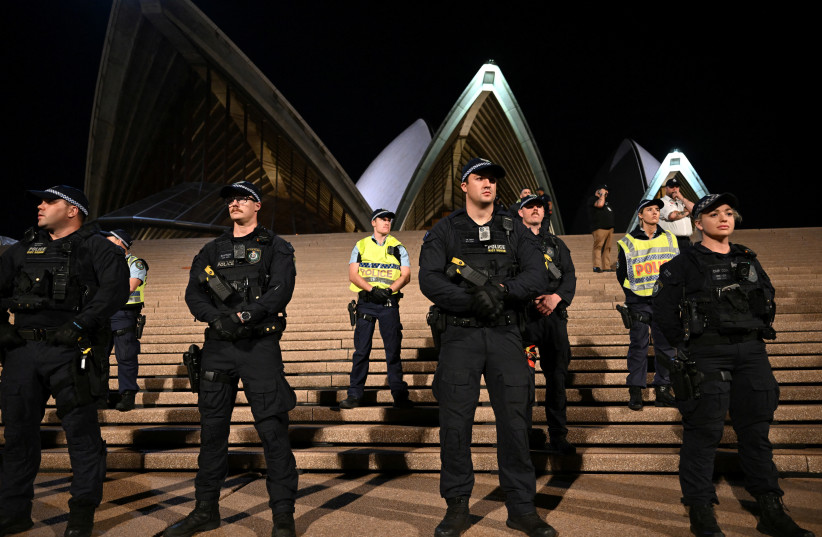  Police look on during a pro-Palestinian rally outside the Sydney Opera House in Sydney, October 9, 2023.  (credit: AAP IMAGE/DEAN LEWINS VIA REUTERS)