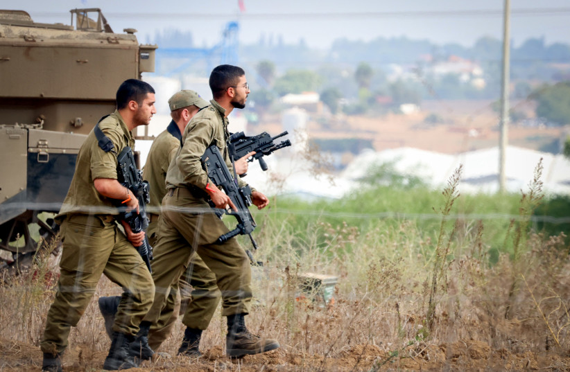  Israeli soldiers at a staging area near the Israeli-Gaza Border, southern Israel, October 10, 2023.  (credit: YOSSI ZAMIR/FLASH90)