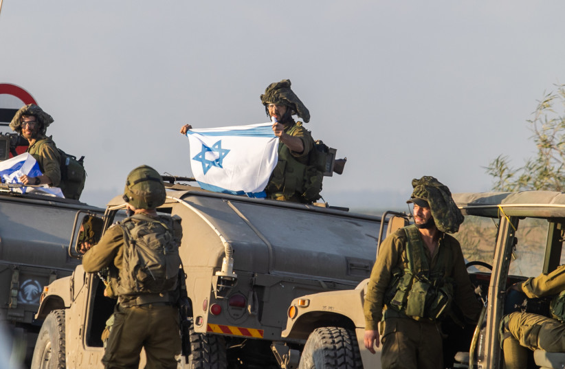  Israeli soldiers patrol on a road near the Israeli-Gaza border, in southern Israel, October 11, 2023 (credit: FLASH90/CHAIM GOLDBERG)