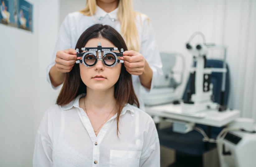 Woman at the optometrist (illustrative). (credit: INGIMAGE)