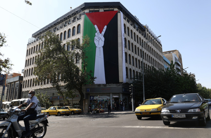 A HUGE Palestinian flag is seen on a building in a street in Tehran, this week. (credit: MAJID ASGARIPOUR/REUTERS)