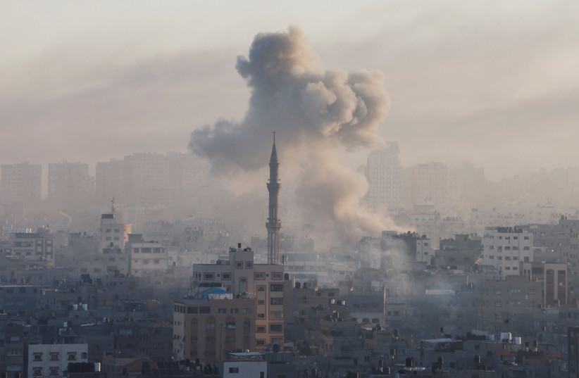  Smoke billows following Israeli strikes amid the ongoing conflict between Israel and the Palestinian Islamist group Hamas, in Gaza, October 13, 2023.  (credit: MOHAMMED SALEM/REUTERS)
