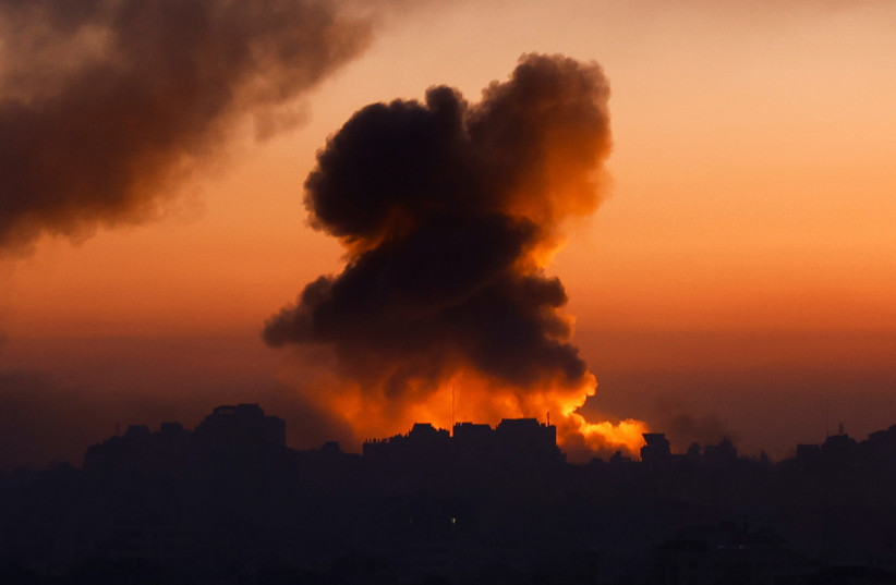 Smoke billows following Israeli strikes amid the ongoing conflict between Israel and the Palestinian Islamist group Hamas, in Gaza, October 13, 2023. (credit: REUTERS/MOHAMMED SALEM)