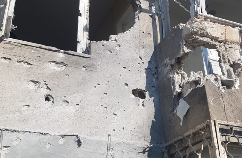 The impact of a rocket hit on an apartment building in Sderot, southern Israel, October 13, 2023