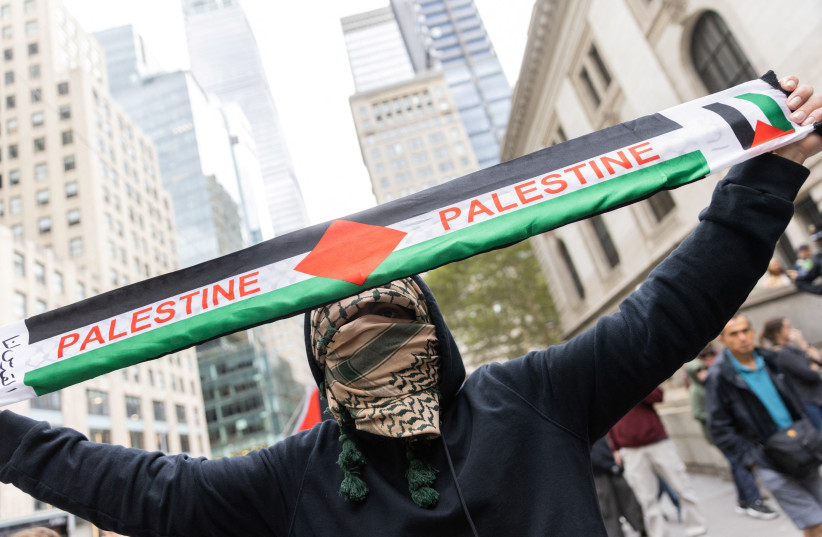  Pro-Palestinian demonstrators protest during the second day of the ongoing conflict between Israel and the Palestinian militant group Hamas, in Manhattan in New York City, U.S., October 8, 2023.  (credit: REUTERS/JEENAH MOON)