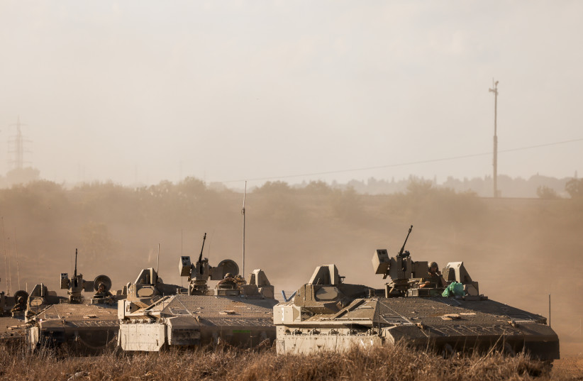  A convoy of military vehicles seen near the Israeli-Gaza border, in southern Israel, October 15, 2023. (credit: Chaim Goldberg/Flash90)