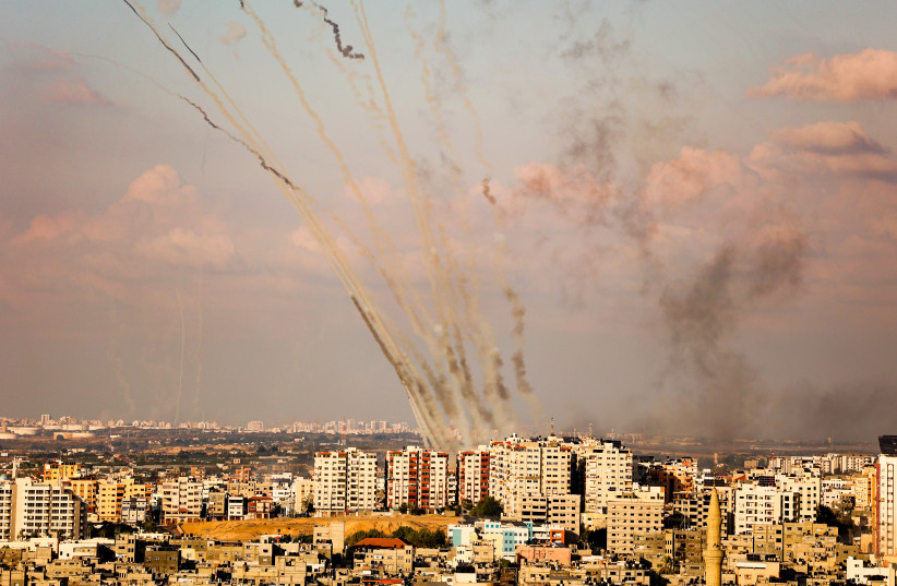  Rockets are fired from Gaza towards Israel, in the southern Gaza Strip, on October 10, 2023. (credit: ATIA MOHAMMED/FLASH90)
