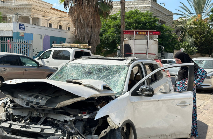  Destroyed cars litter the street following a rocket attack on Ramla, Israel, Oct. 12, 2023. (credit: DARIO SANCHEZ/THE MEDIA LINE)