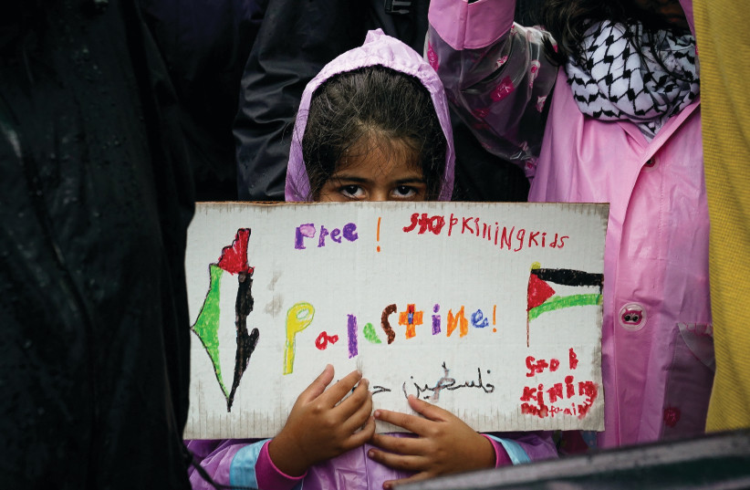  A GIRL holds a sign with a map of Palestine that includes the State of Israel, at a rally called ‘Day of Action for Palestine,’ near the White House, on Saturday.  (credit: Elizabeth Frantz/Reuters)