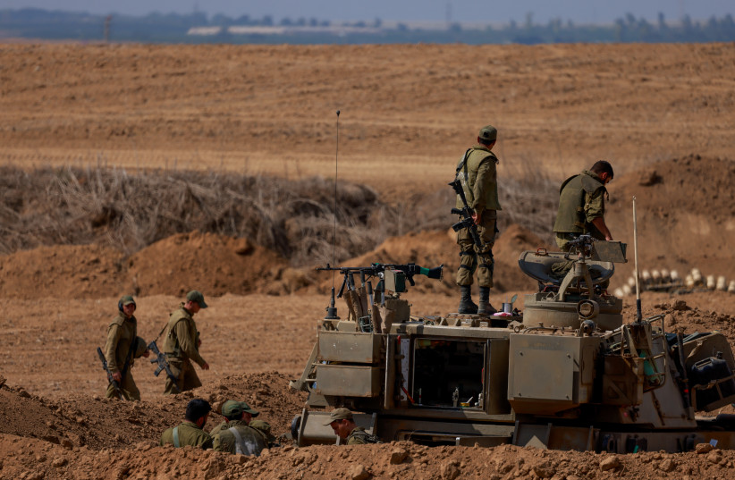  Israeli soldiers seen at a staging area near the southern Israeli border with Gaza, October 12, 2023.  (credit: Chaim Goldberg/Flash90)