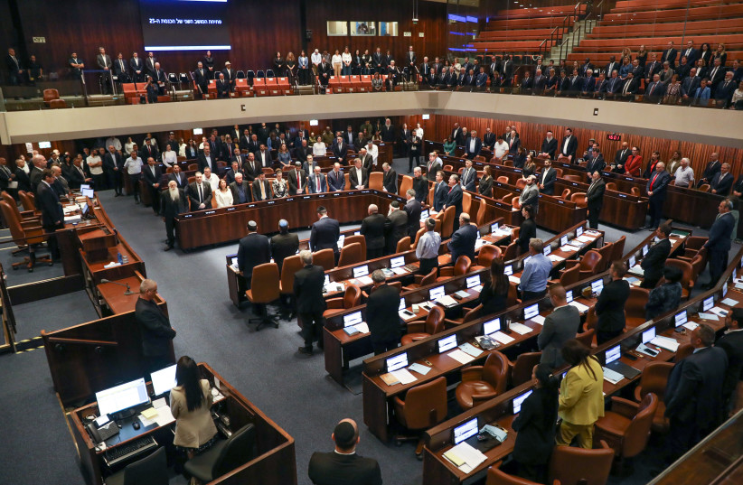  Israeli members of parliament stand for a minute of silence in memory of the Israelis murdered when Hamas militants infiltrated southern Israel more than a week ago, killing more than 1300. October 16, 2023.  (credit: NOAM REVKIN/FLASH90)